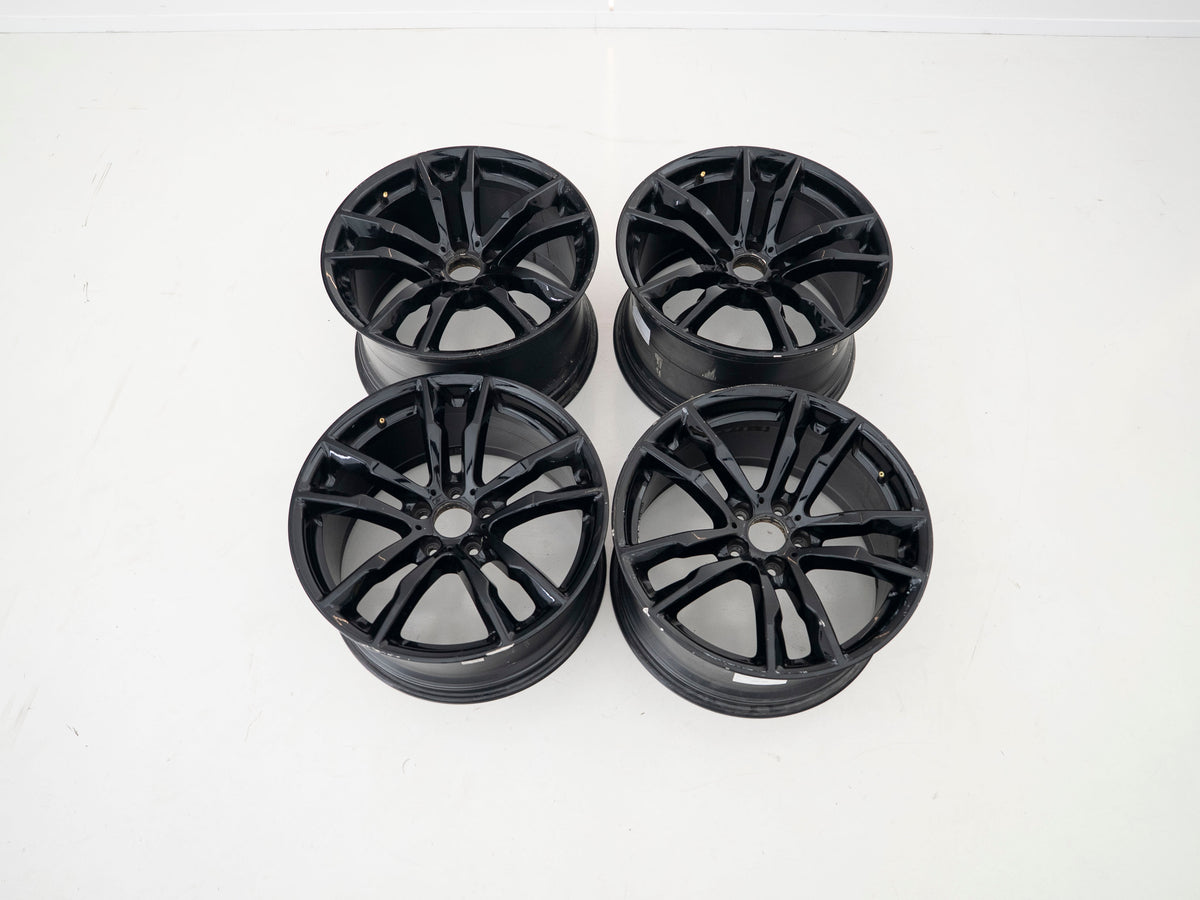BMW 611M 20-inch four-wheel set — two front and two rear wheels, actual stock photograph