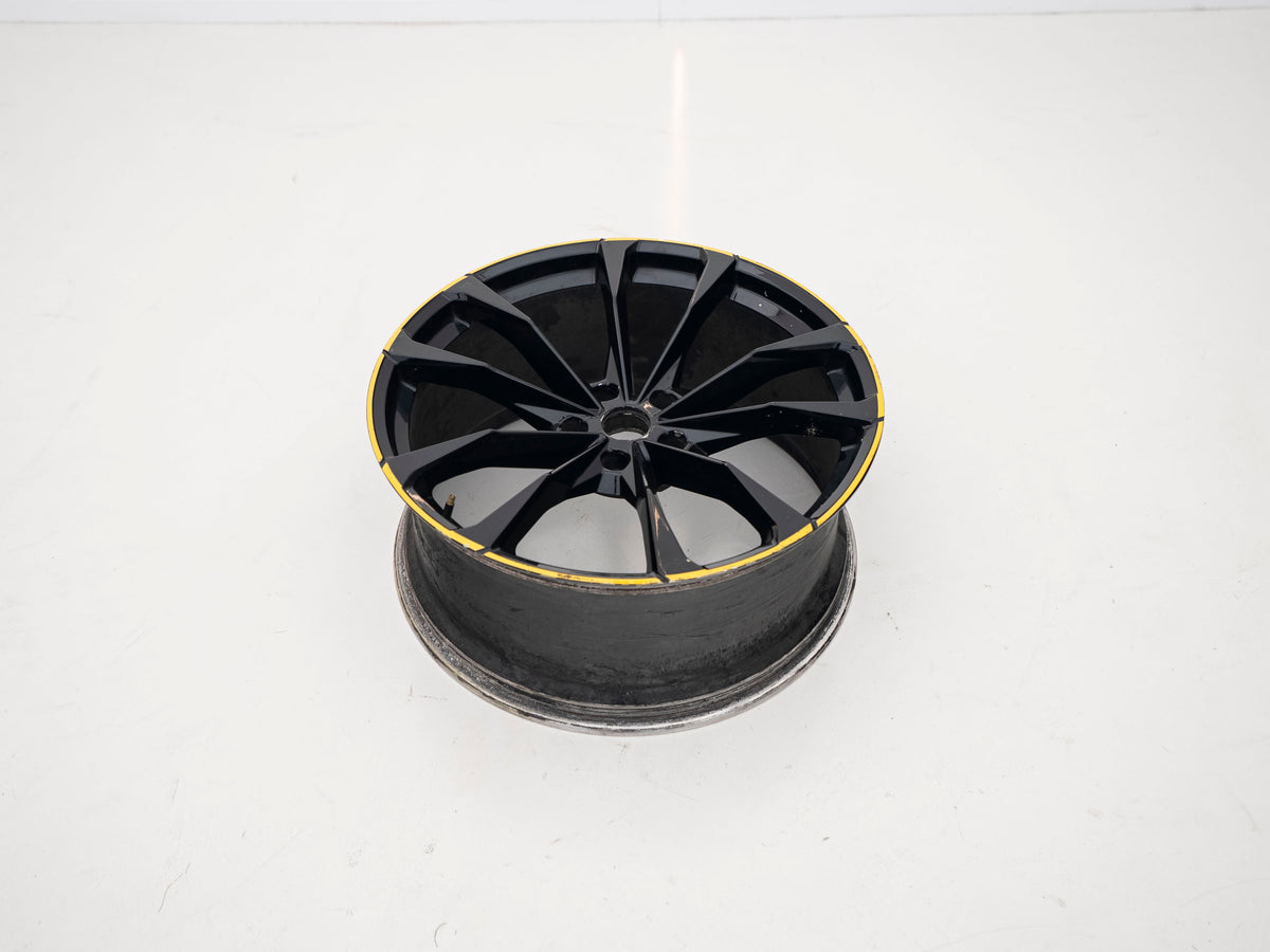 Used Lamborghini Urus 23-inch wheel with black face and yellow outer edge