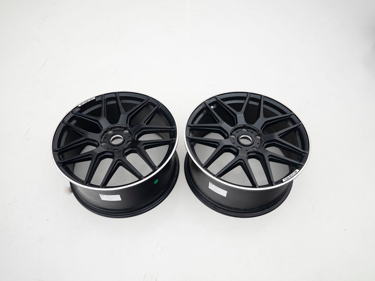 AMG 22-inch wheels, black face and silver lip — actual stock photograph