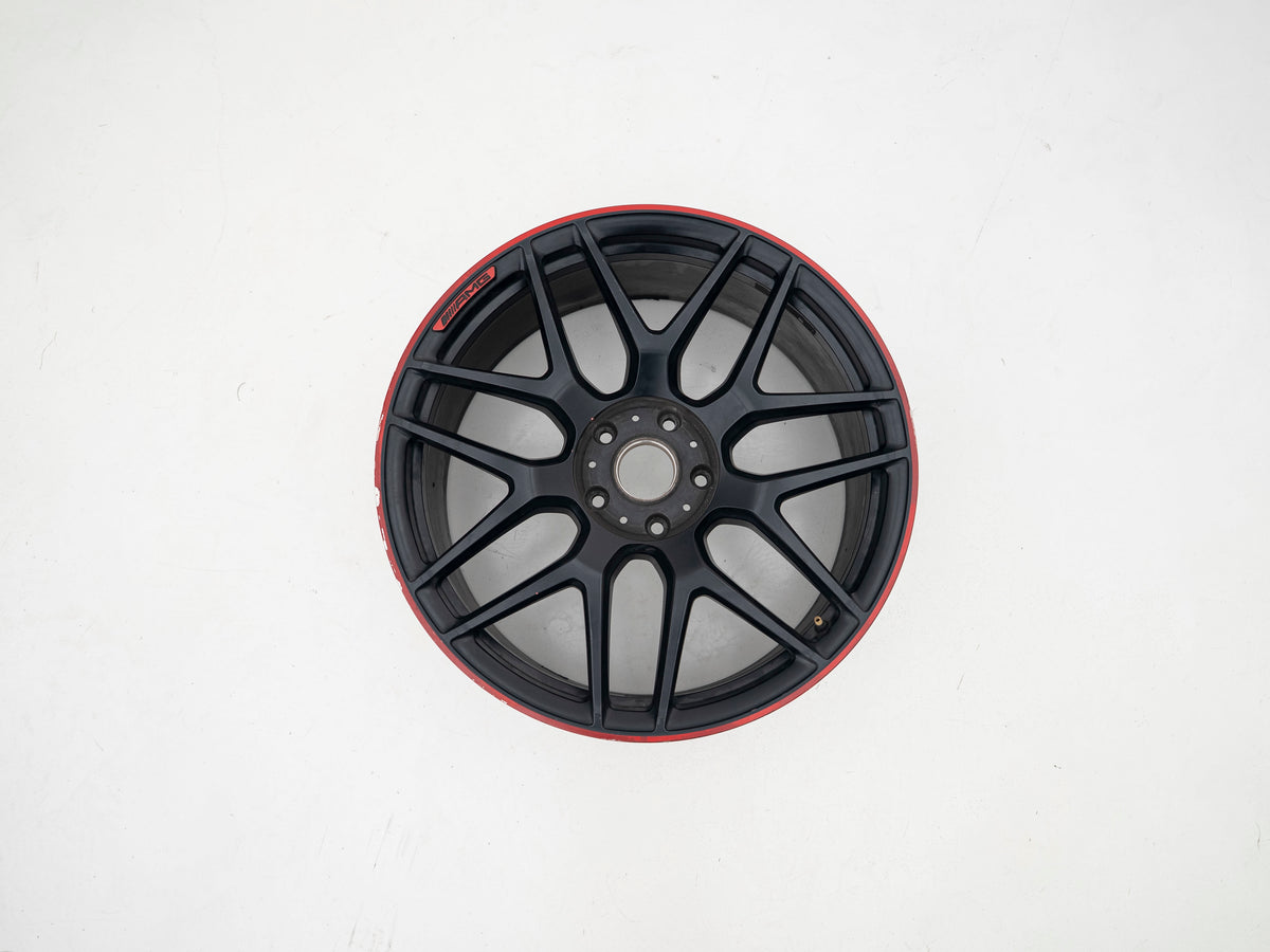 AMG 22-inch wheels, red barrel, black face and red lip — actual stock photograph