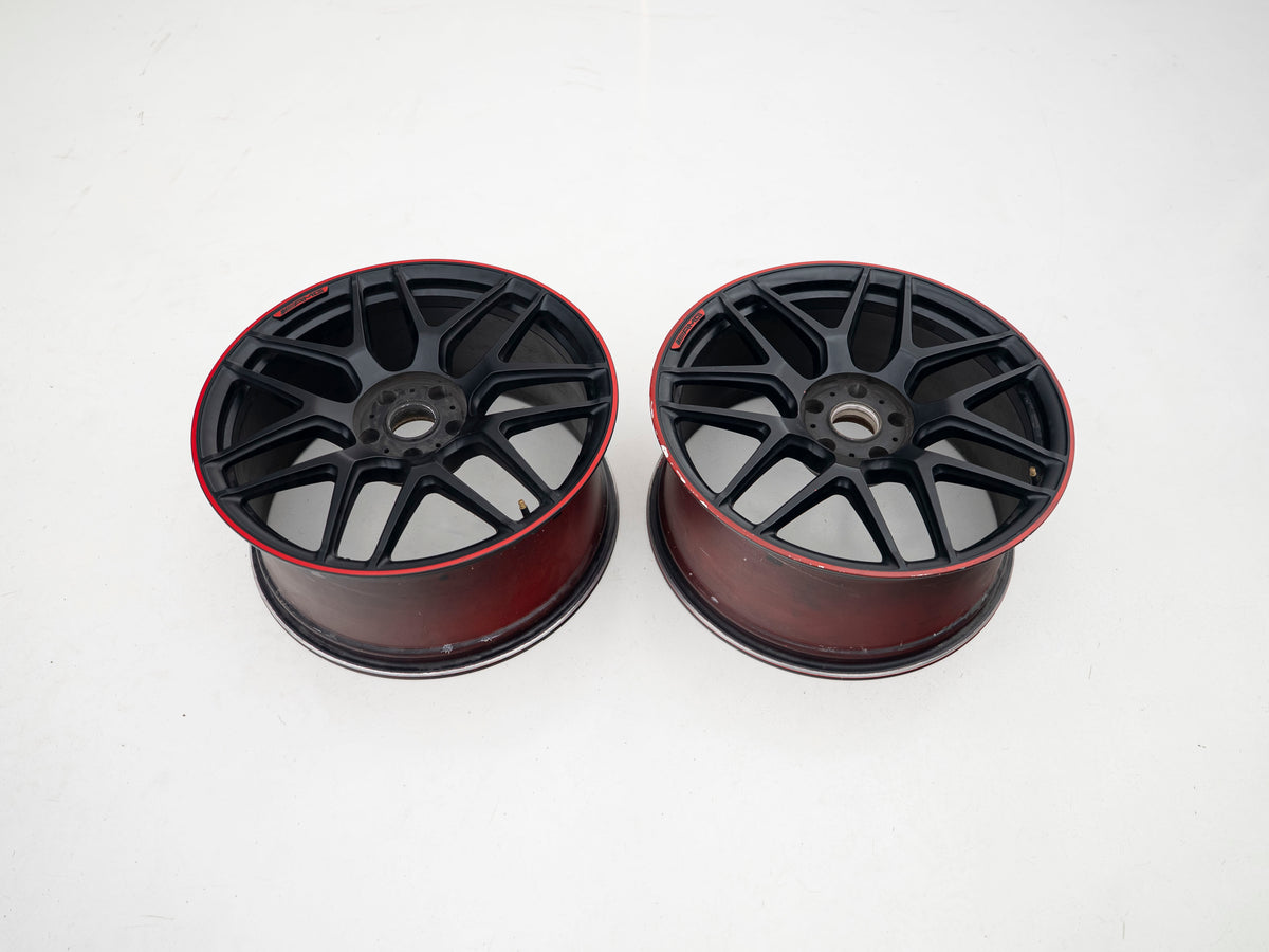 AMG 22-inch wheels, red barrel, black face and red lip — actual stock photograph