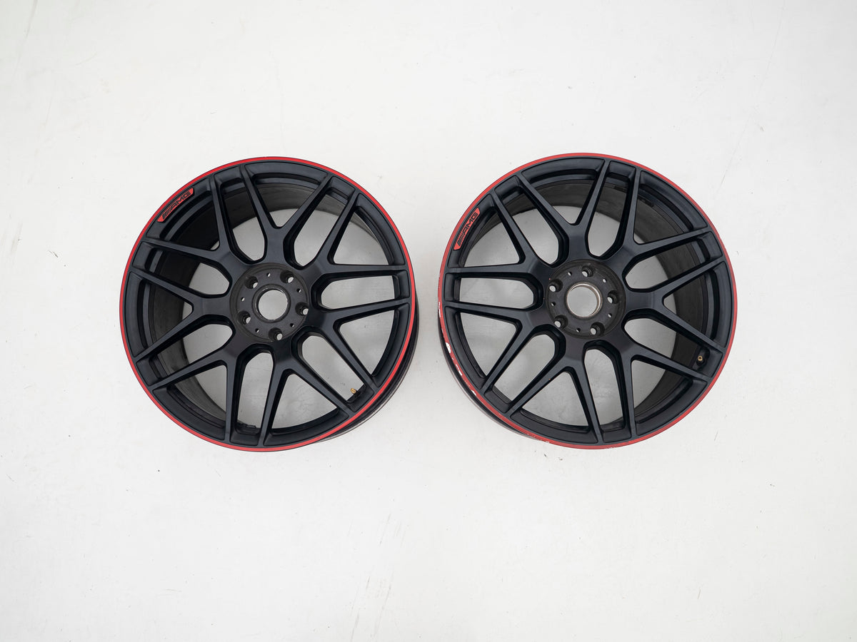 AMG 22-inch wheels, red barrel, black face and red lip — actual stock photograph