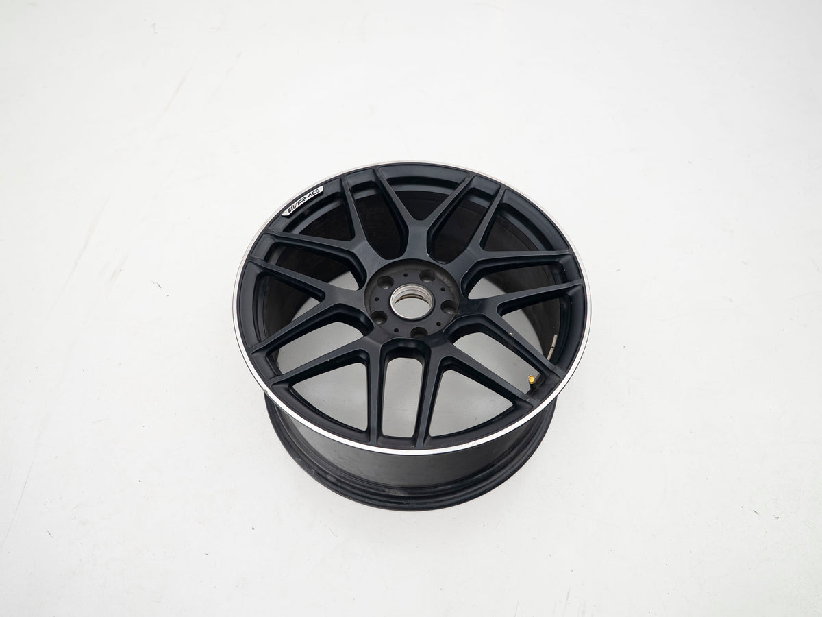 AMG 22-inch wheels, black barrel and face with silver lip — actual stock photograph