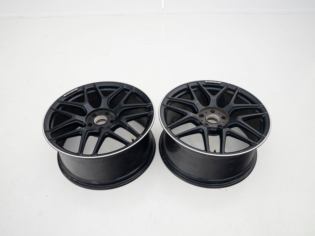 AMG 22-inch wheels, black barrel and face with silver lip — actual stock photograph