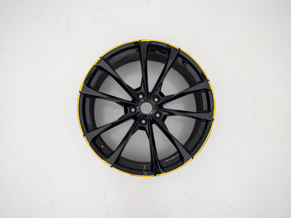 Used Lamborghini Urus 23-inch wheel with black face and yellow outer edge
