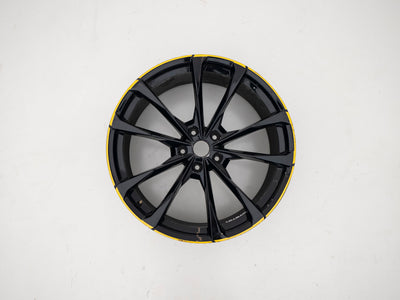 Used Lamborghini Urus 23-inch wheel with black face and yellow outer edge