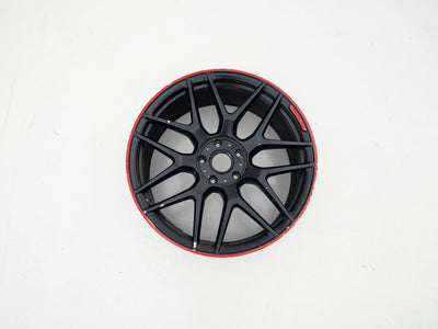 Used AMG 22-inch wheel with black face and red lip, front view