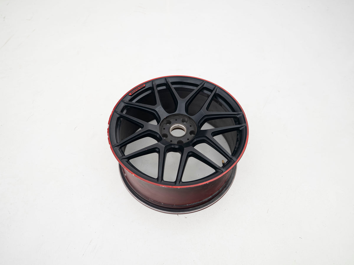 AMG 22-inch wheels, red barrel, black face and red lip — actual stock photograph