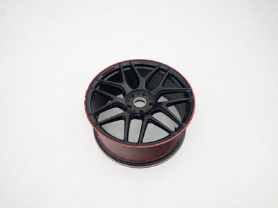 AMG 22-inch wheels, red barrel, black face and red lip — actual stock photograph
