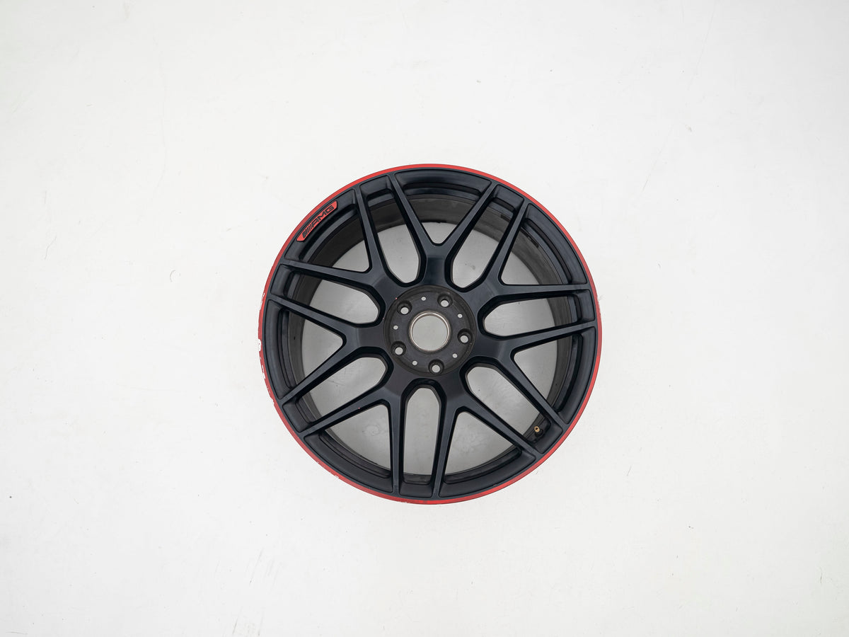 AMG 22-inch wheels, red barrel, black face and red lip — actual stock photograph