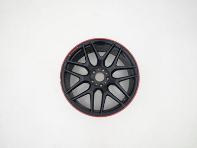 AMG 22-inch wheels, red barrel, black face and red lip — actual stock photograph