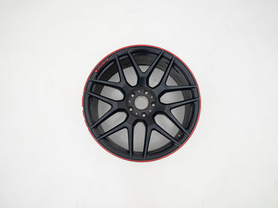 AMG 22-inch wheels, red barrel, black face and red lip — actual stock photograph