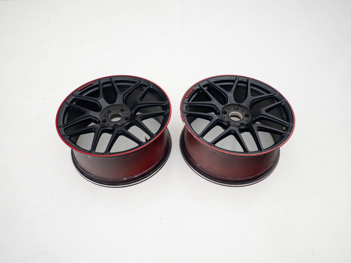 AMG 22-inch wheels, red barrel, black face and red lip — actual stock photograph