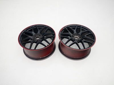 AMG 22-inch wheels, red barrel, black face and red lip — actual stock photograph