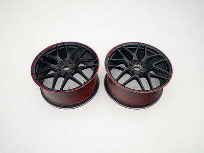 AMG 22-inch wheels, red barrel, black face and red lip — actual stock photograph