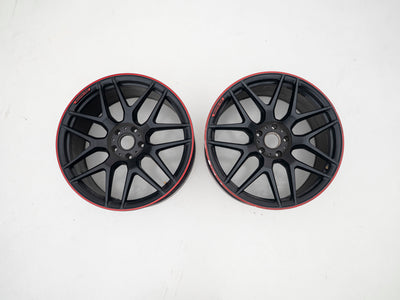 AMG 22-inch wheels, red barrel, black face and red lip — actual stock photograph