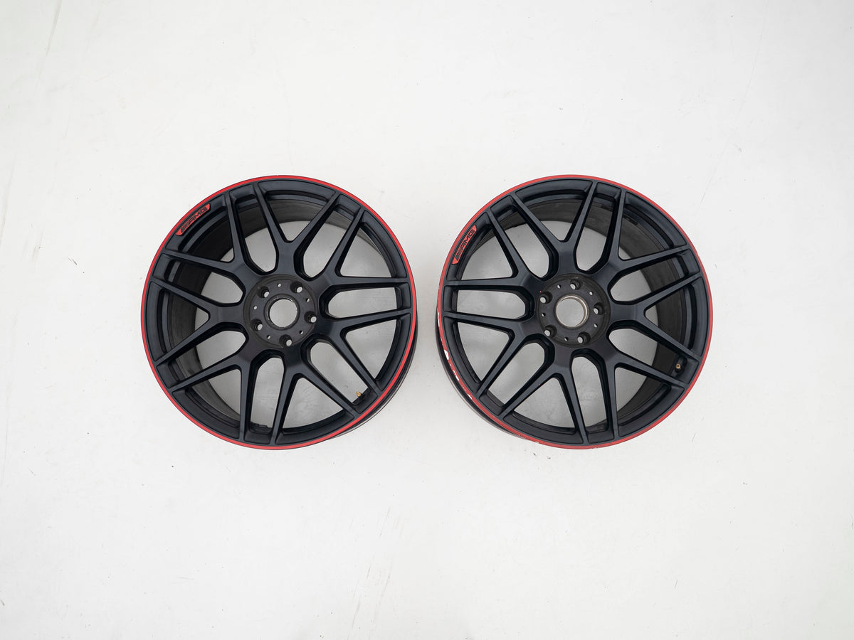 AMG 22-inch wheels, red barrel, black face and red lip — actual stock photograph
