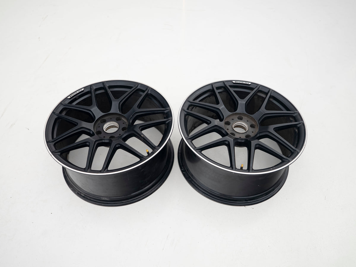AMG 22-inch wheels, black barrel and face with silver lip — actual stock photograph