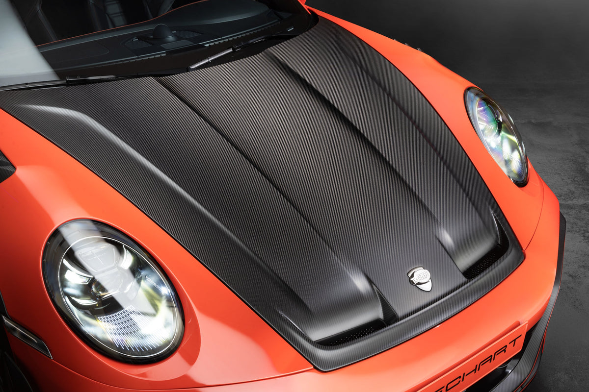 TECHART 992 aero hood with integrated air ducts on lava orange Porsche 911